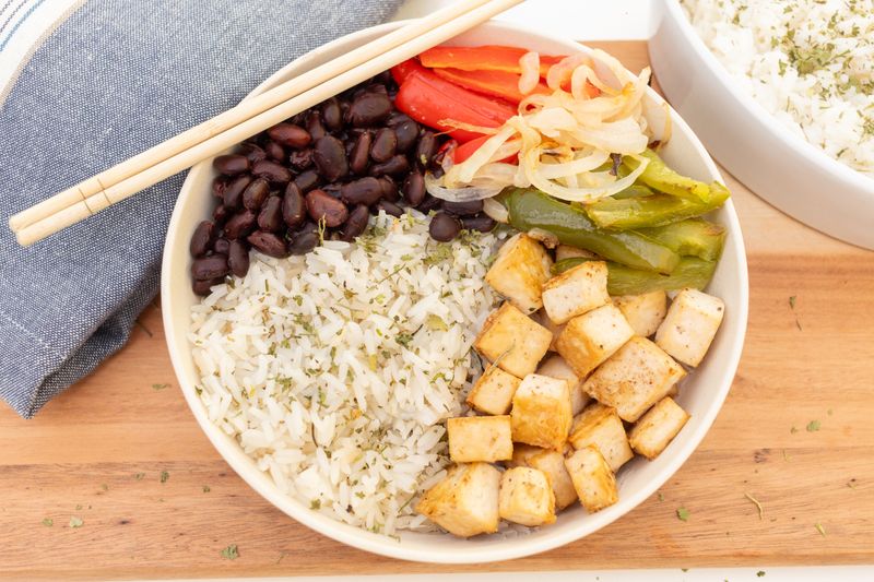 Vegan black bean rice bowl with colorful vegetables